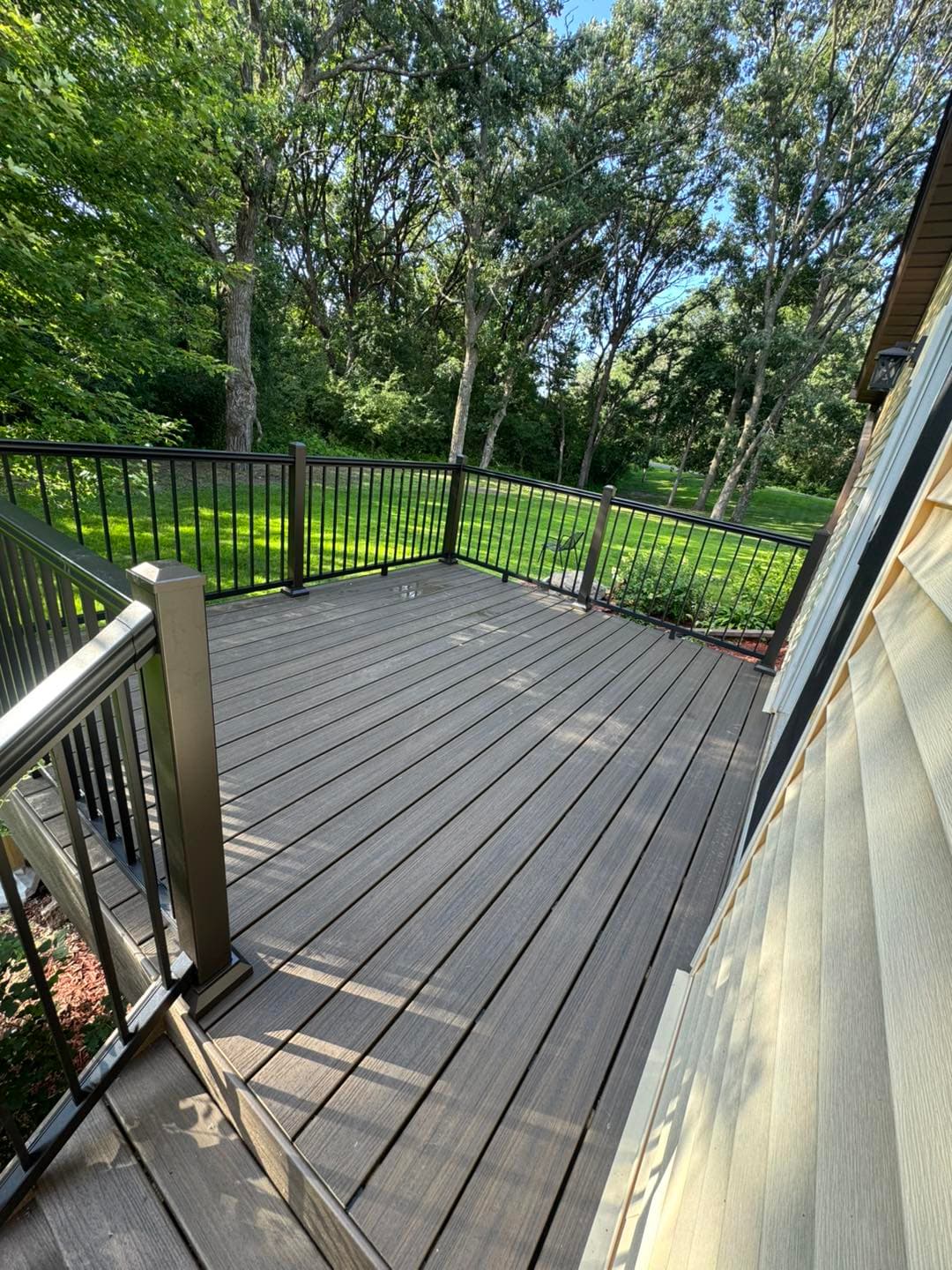 Finished black composite deck with stairs