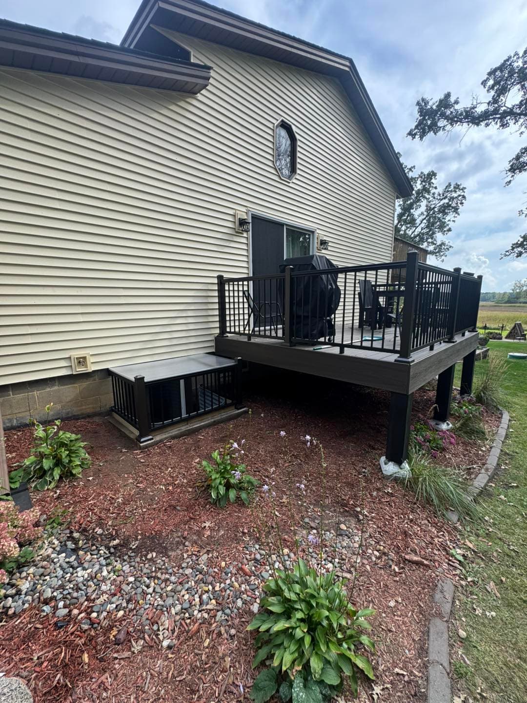 Deck with black railings and stair system