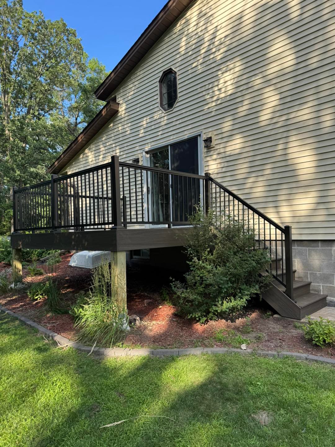 Dark composite deck with black railings
