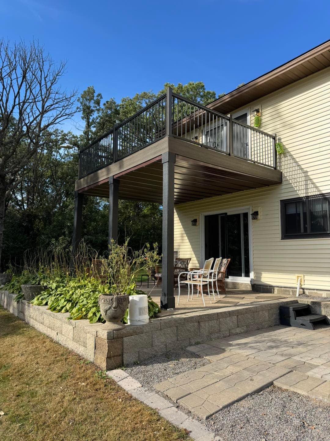 Elevated deck with covered patio and outdoor living space